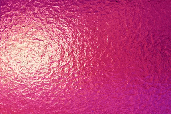 Eine sehr große Platte aus fein zerknitterter goldrosa Folie — Stockfoto