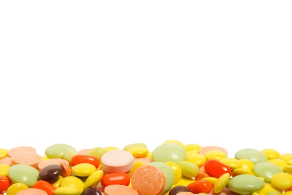 Comprimidos e cápsulas sobre fundo branco — Fotografia de Stock