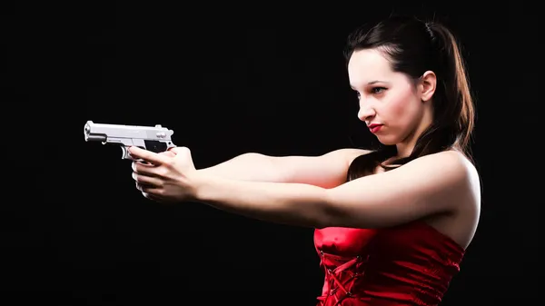 Sexy young woman - gun on black background — Stock Photo, Image