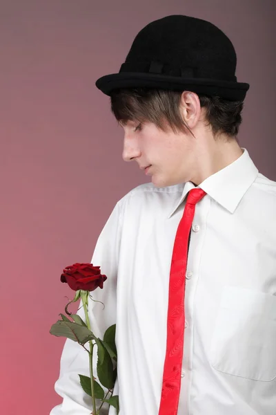 Portrait young man and rose enamoured love Stock Photo