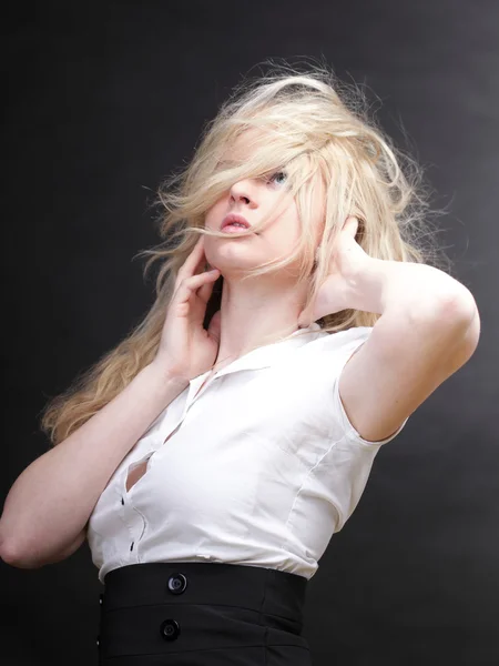 Blonde woman with her hair blowing Stock Picture