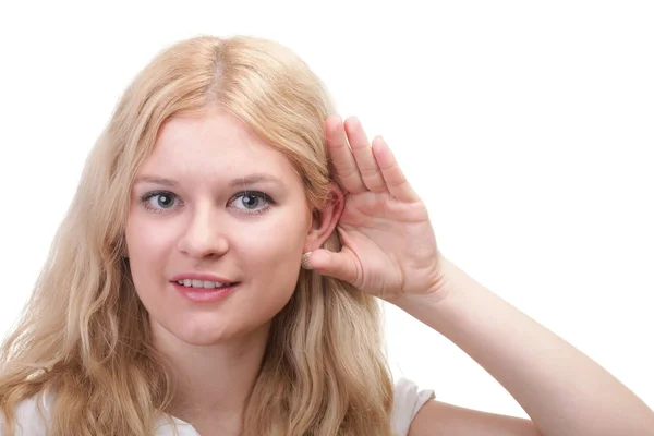 Woman eavesdropping with hand behind her ear — Stock Photo, Image