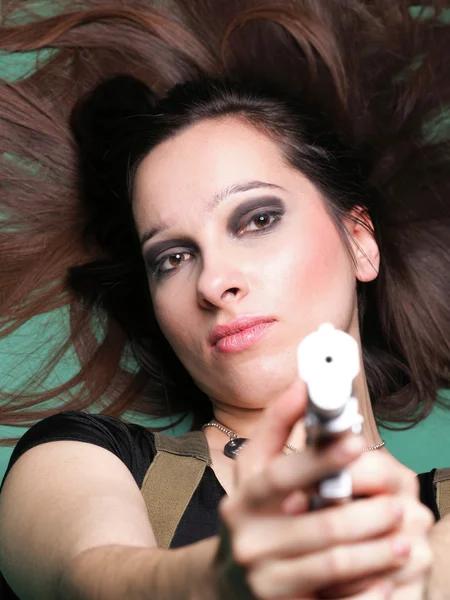 Sexy young woman long hair - gun — Stock Photo, Image