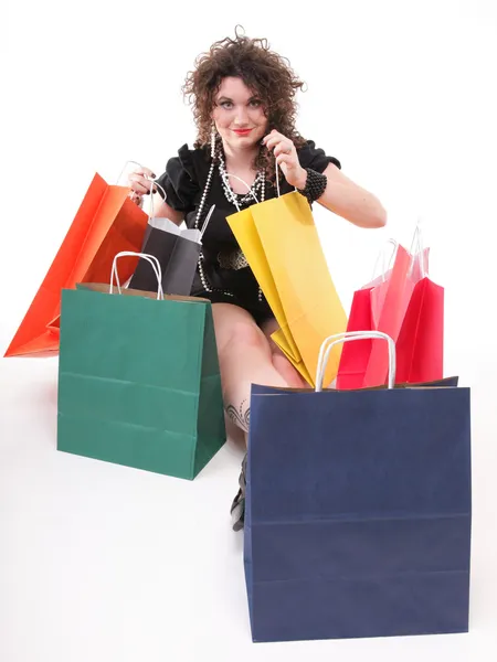 Belle femme avec des sacs à provisions — Photo