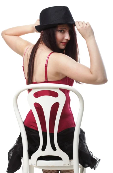 Showgirl mujer danza en rojo corsé silla blanco aislado —  Fotos de Stock