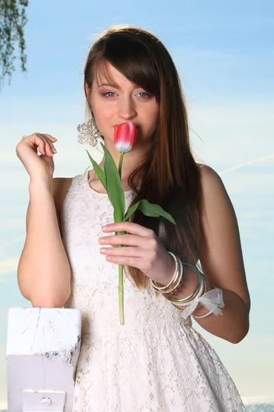 Smiling woman with tulip flowers — Stock Photo, Image