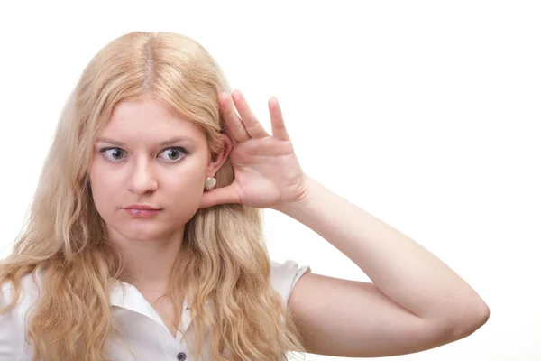 Woman eavesdropping with hand behind her ear — Stock Photo, Image