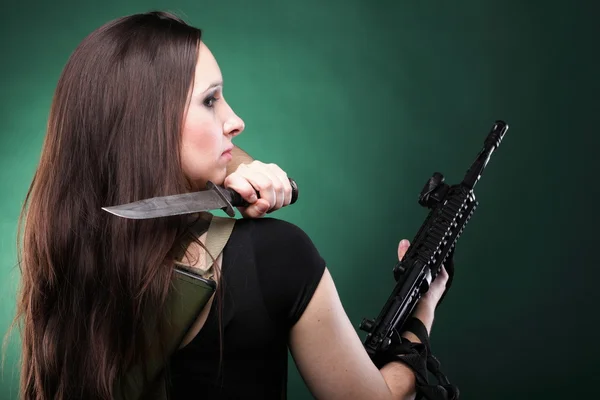 Sexy young woman long hair - gun knife — Stock Photo, Image