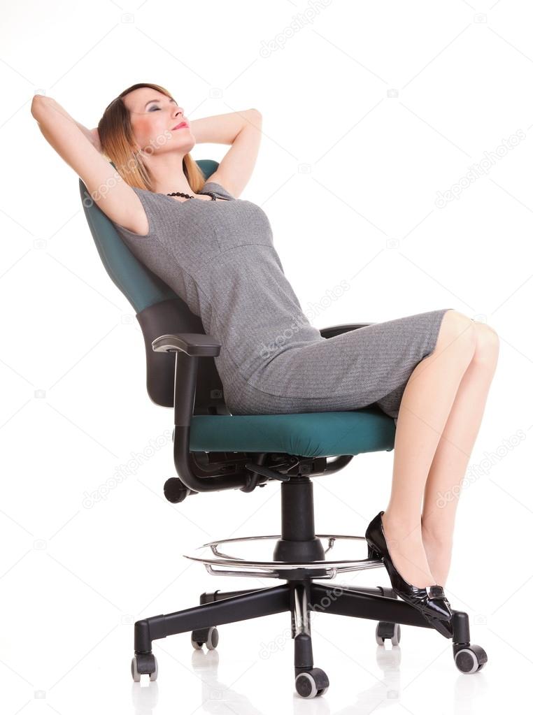 Full length business woman sitting on chair holding clipboard is