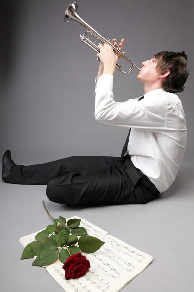 Portrait of a young man playing love his Trumpet — Stock Photo, Image