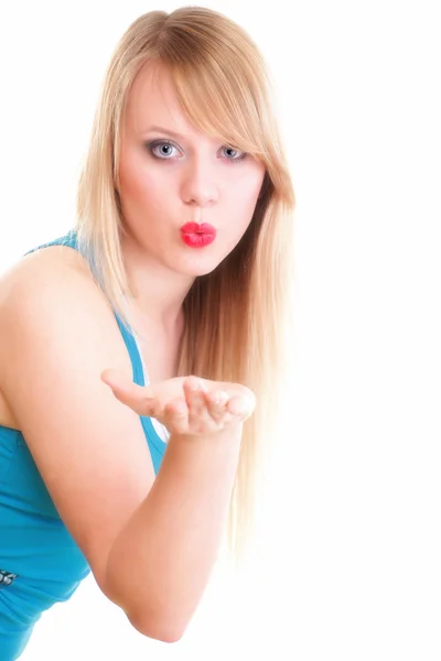 Beautiful young woman blowing a kiss — Stock Photo, Image