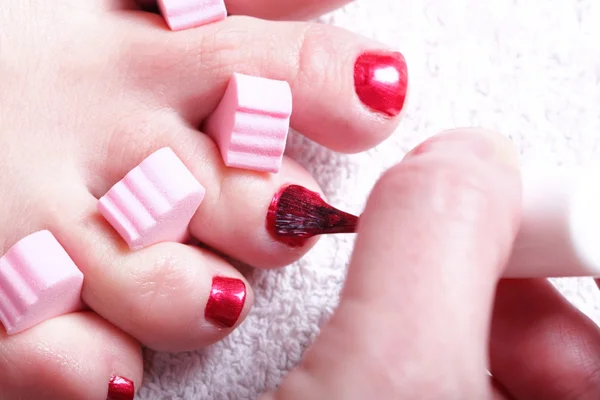 Female feet red polished nails — Stock Photo, Image