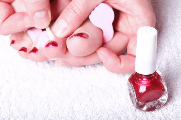 Female feet red polished nails — Stock Photo, Image