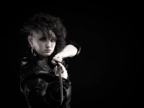 Piercing woman curly girl and sword — Stock Photo, Image