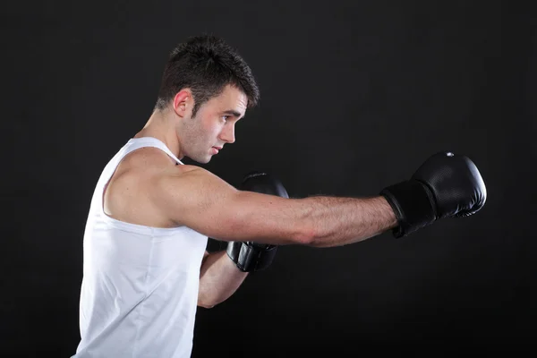 Portrait sportsman boxer in studio dark background — Stock Photo, Image