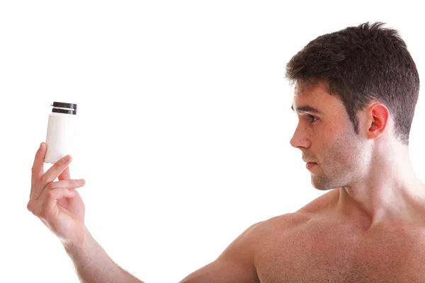 Holding a boxes with supplements on his biceps — Stock Photo, Image