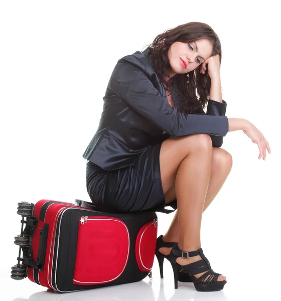 Full length young business woman to late red travel bag — Stock Photo, Image