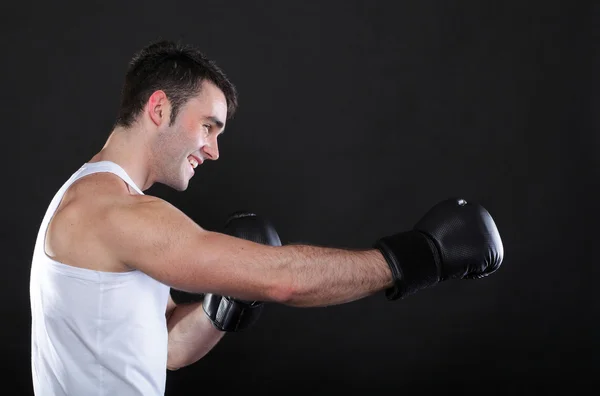 Portrait sportsman boxer in studio dark background — Stock Photo, Image