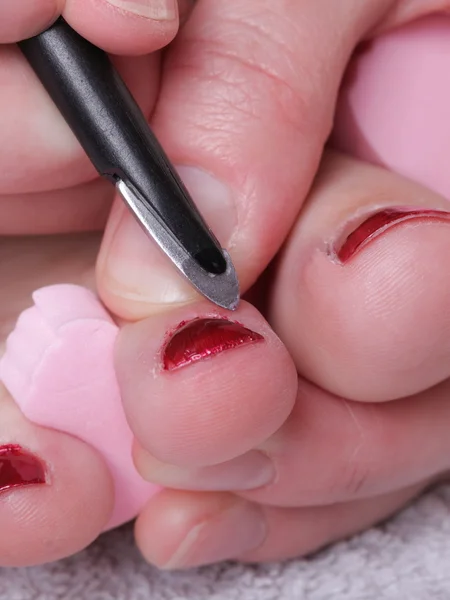 Female feet red polished nails — Stock Photo, Image