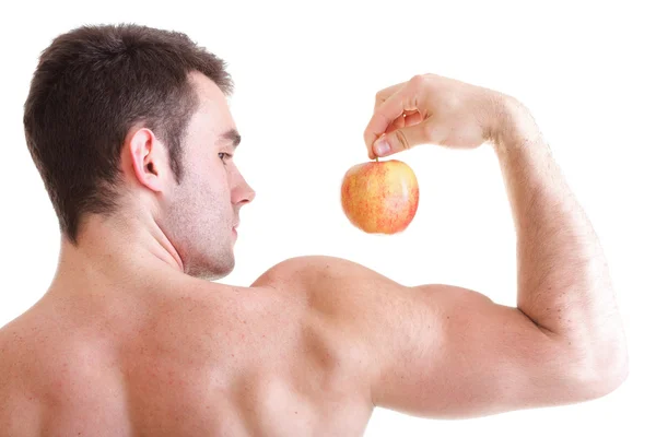 Athletic sexy male body builder holding red apple — Stock Photo, Image