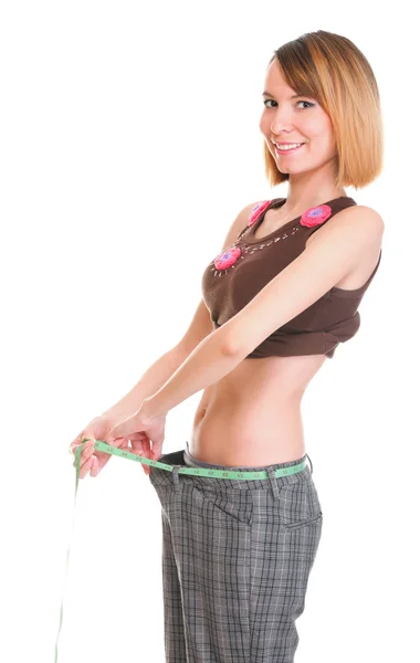 Красивая женщина показывает свою потерю веса носить измерительные ленты изолировать — стоковое фото