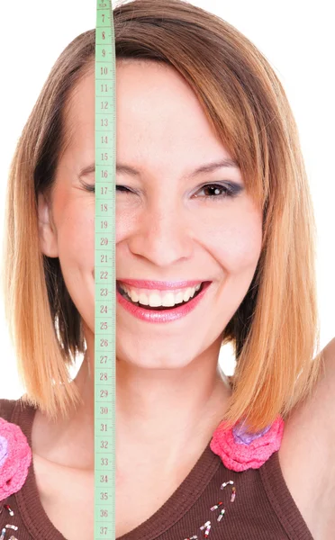 Beautiful young caucasian woman measuring her body with tape iso — Stock Photo, Image