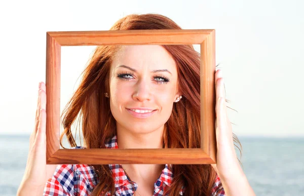 Woman Holding Frame travel concept — Stock Photo, Image