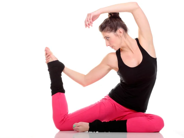 Beautiful young brunette woman stretching muscles arms isolated — Stock Photo, Image