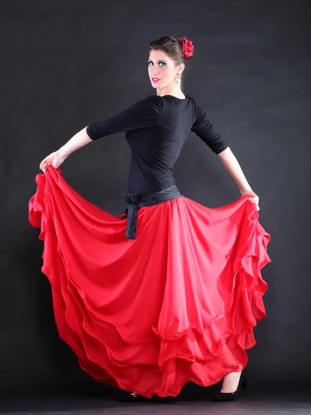 Attractive spanish young woman dancing flamenco over black backg — Stock Photo, Image