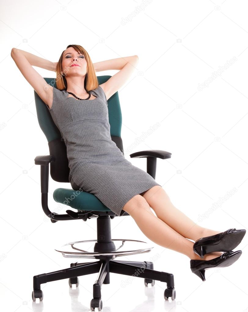 Full length business woman sitting on chair holding clipboard is