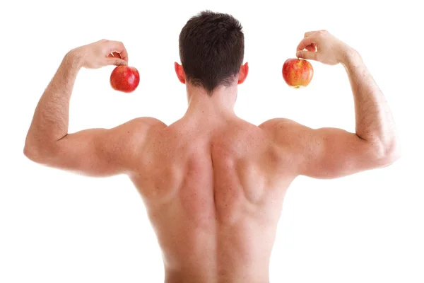 Athletic sexy male body builder holding red apple — Stock Photo, Image