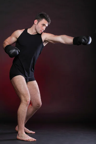 Portrait sportsman boxer in studio dark background — Stock Photo, Image