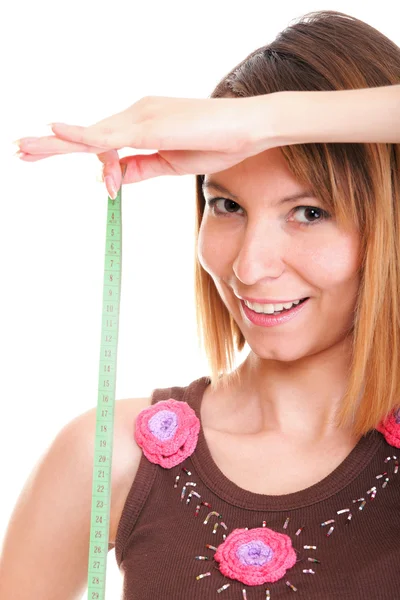 Beautiful young caucasian woman measuring her body with tape iso — Stock Photo, Image