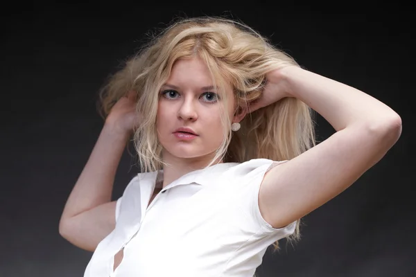 Blonde woman with her hair blowing — Stock Photo, Image