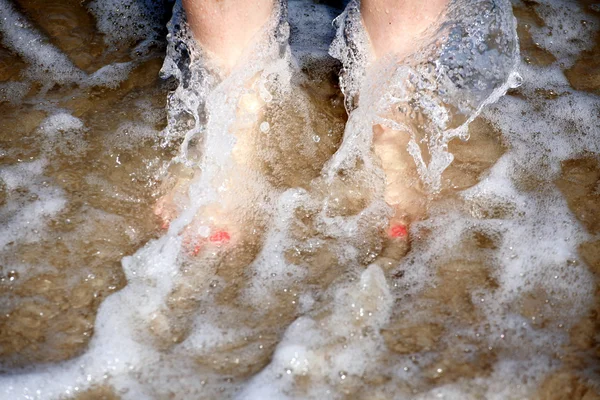 Nice legs in water — Stock Photo, Image