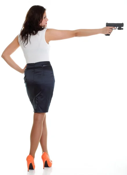 Young brunette woman with gun isolated on white — Stock Photo, Image