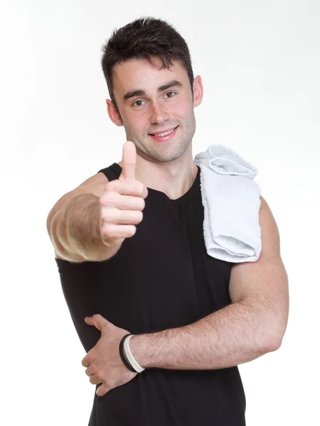 Healthy happy young man thumb up towel isolated — Stock Photo, Image