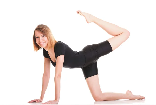 Deporte Mujer joven haciendo ejercicio aislado en blanco — Foto de Stock