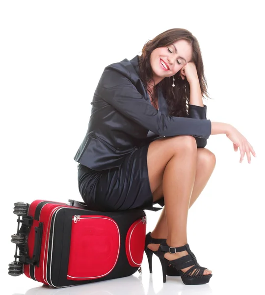 Full length young business woman to late red travel bag — Stock Photo, Image