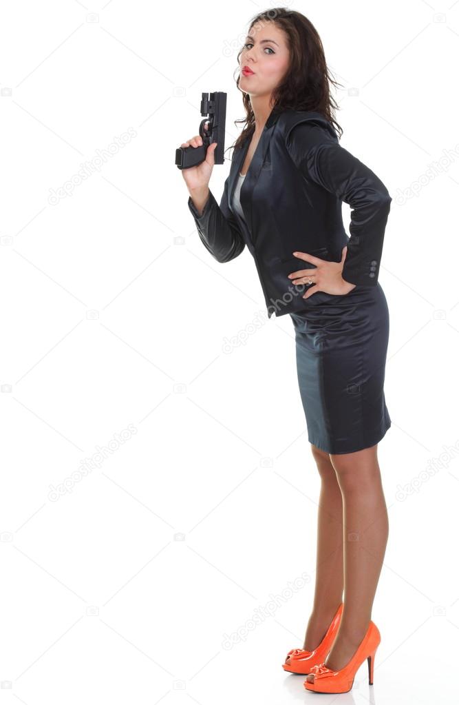 Young brunette woman with gun isolated on white