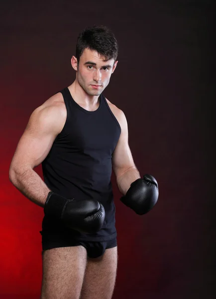 Portrait sportsman boxer in studio dark background — Stock Photo, Image