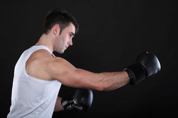 Portrait sportsman boxer in studio dark background — Stock Photo, Image