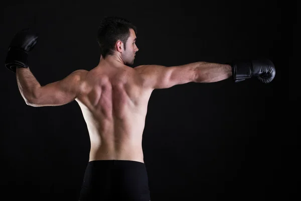 Portrait sportsman boxer in studio dark background — Stock Photo, Image