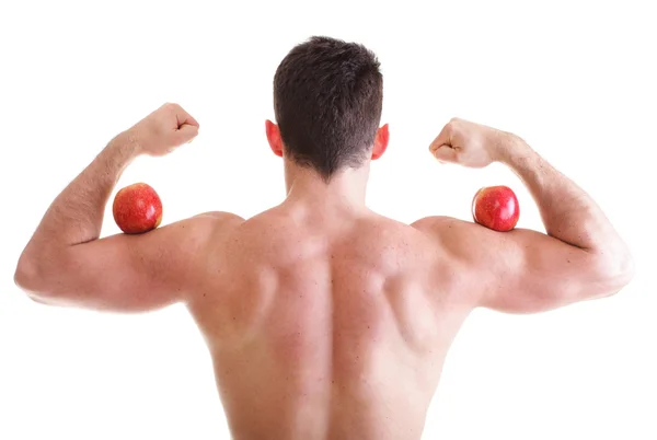 Athletic sexy male body builder holding red apple — Stock Photo, Image