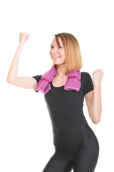 Fitness woman jumping excited isolated female smiling showing — Stock Photo, Image