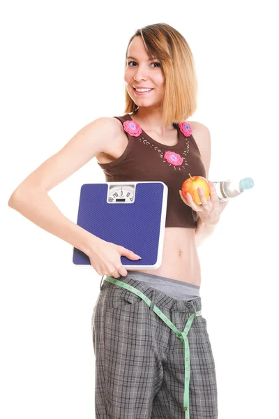 Beautiful young caucasian woman measuring her body with tape — Stock Photo, Image