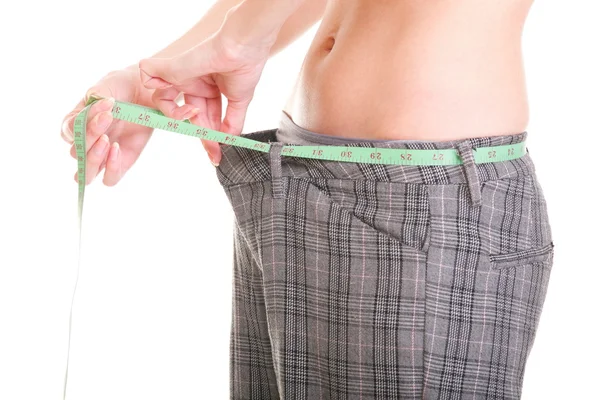 Woman showing how much weight she lost — Stock Photo, Image