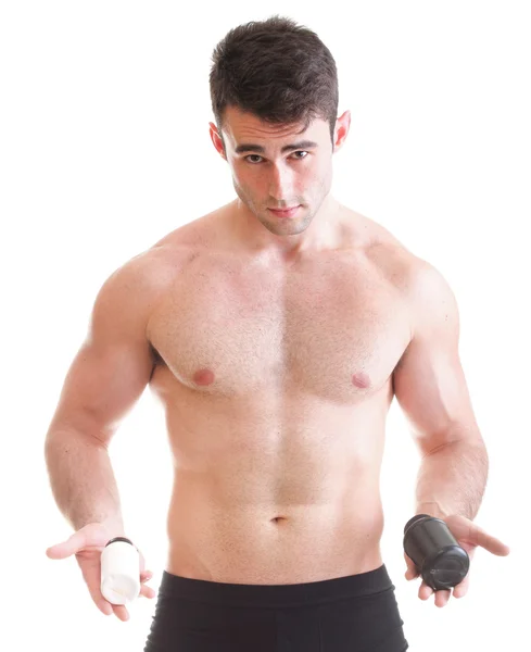 Holding a boxes with supplements on his biceps — Stock Photo, Image