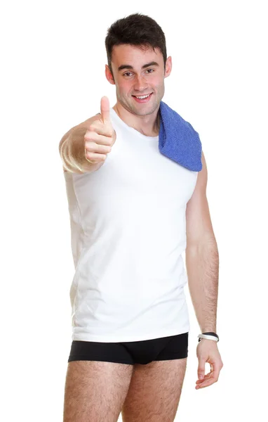 Egészséges, boldog fiatalember hüvelykujjával felfelé elszigetelt törölköző — Stock Fotó