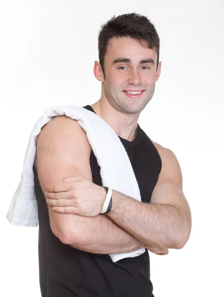 Zdrowy młody człowiek z ręcznikiem na białym tle — Zdjęcie stockowe